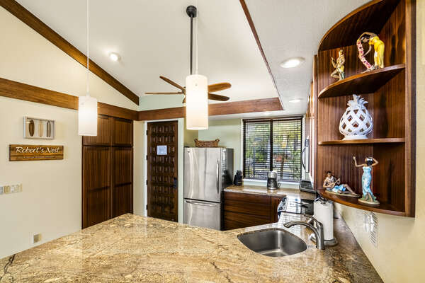 Full Kitchen with Stainless Steel Appliances and Marble Counter Tops