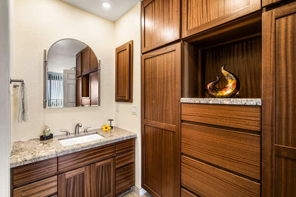 Master Bathroom with Beautiful Wooden Cabinetry and Vanity