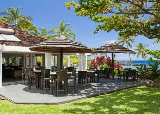 Picture of the Mauna Lani Beach Club with Outdoor Tables and Chairs