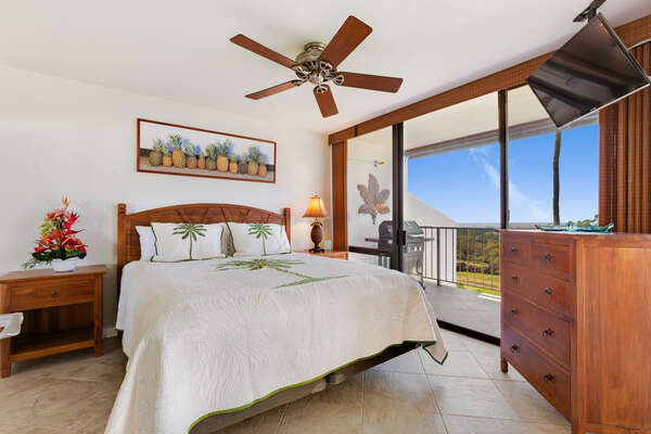 Primary Bedroom with King Bed and Flat Screen TV inside our Kona Hawai'i Villa Rental