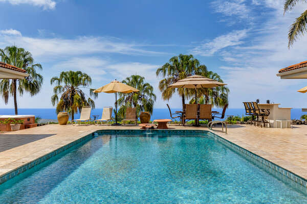Large Private Pool with poolside tables and seating at this Kona Hawaii vacation rental/
