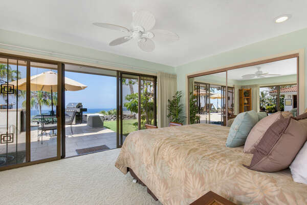 Bedroom 2 has a large glass door that opens to Lanai near the BBQ area.