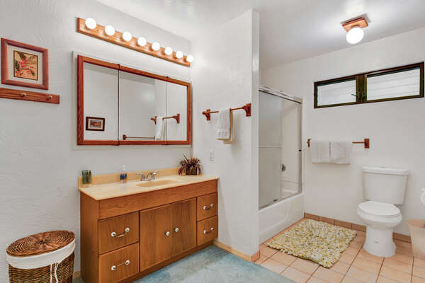 Bathroom 3 ensuite to Bedroom 3 with vanity sink, glass door shower, and toilet.