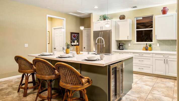 Kitchen with granite countertops, breakfast bar, and stainless-steel appliances