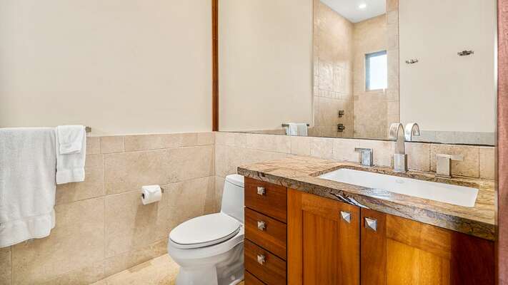 Ensuite to Junior Suite 1 with vanity sink and toilet.