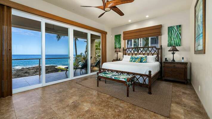 Primary Bedroom with King Bed and Lanai Access at Kona Hawaii Vacation Rentals
