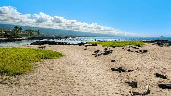 Located steps away from a sandy beach with a protected “keiki” swimming area