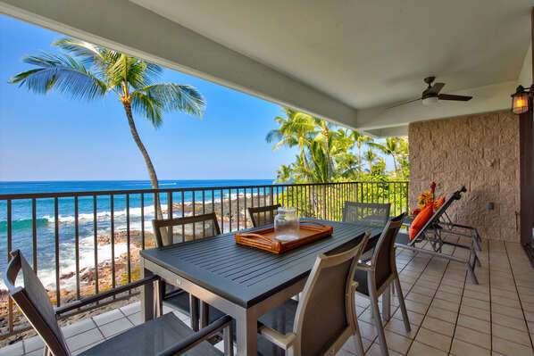 Dining Ocean Front in the lanai of this oceanfront vacation rental, with a table and seating for 6.