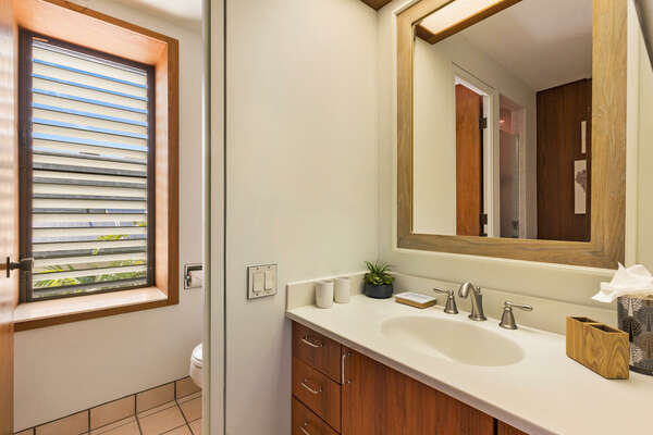 Bathroom 2 with vanity sink and separate toilet room.