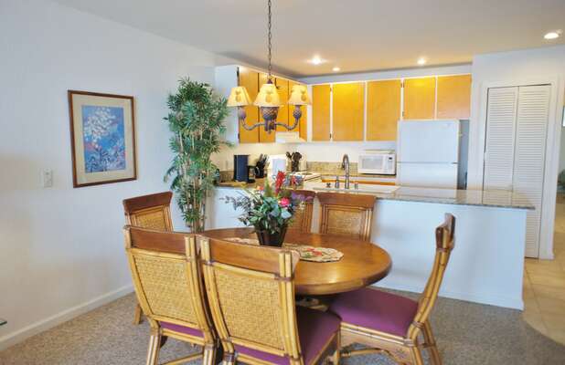 Dining Area seating and kitchen view within kona hawaii vacation rental