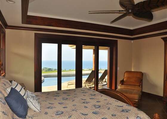 Bedroom with Ocean Views, Large Bed, Armchair and Ceiling Fan