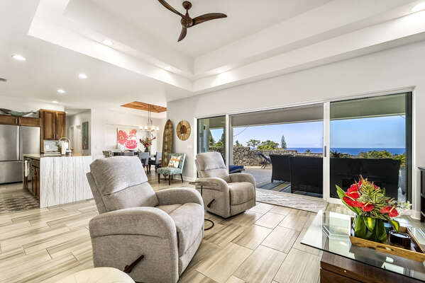 Armchairs, Ceiling Fan, and Sliding Doors to the Covered Lanai