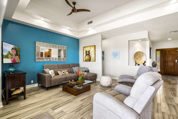 Sofa, Armchairs, Coffee Table, Ceiling Fan, and Smart TV