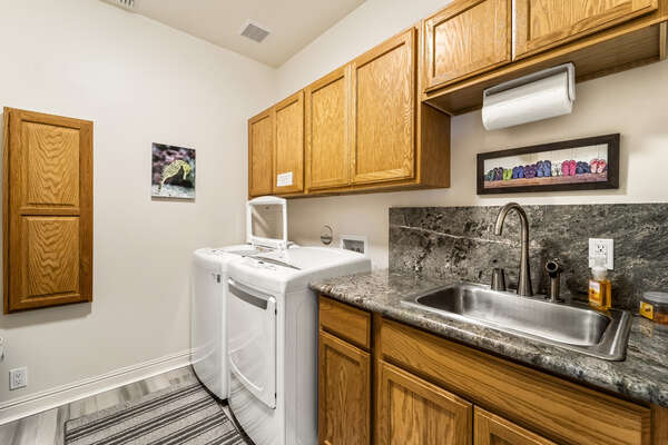Laundry Room with Washer, Dryer, and Sink