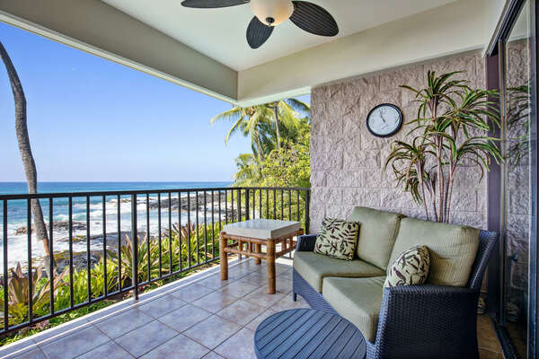 Ocean Front Lounging in the lanai, with cushioned furniture.
