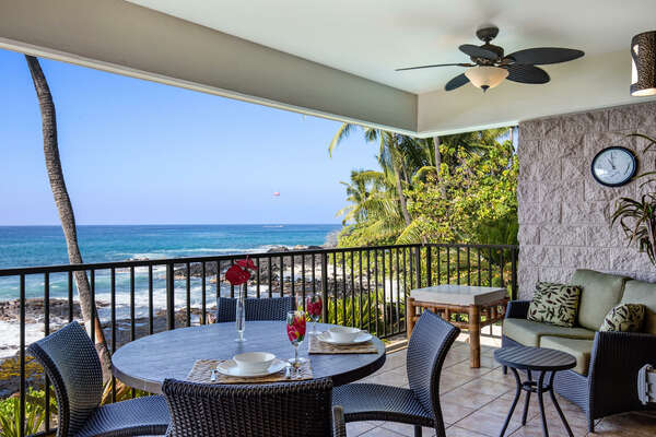 Lanai with table, chairs, and ceiling fan.