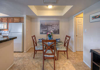 Dining area is ready for 4 people to enjoy casual or elegant meals.