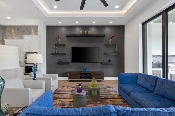 The living area offers a large flatscreen TV
