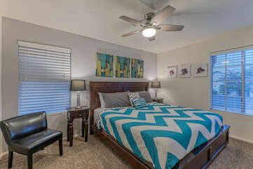 Bedroom 2 is upstairs and has a comfy king bed, large TV and ceiling fan.