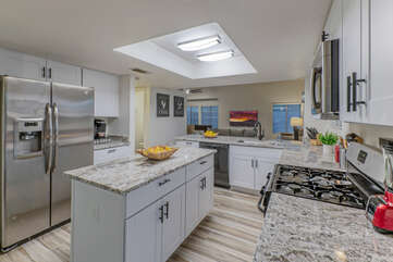 Expansive counter space and island are perfect for serving meals to the home crowd.