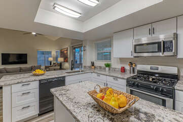 Kitchen features an island and upgraded culinary tools to enhance meal and beverage preps.
