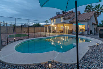 Private, fenced-in pool with heating option provides refreshing dips on warm and sunny days.