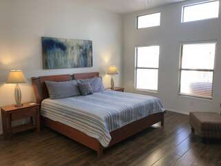 The primary bedroom in MESA MOONDANCE VILLA features a king bed and Smart TV.