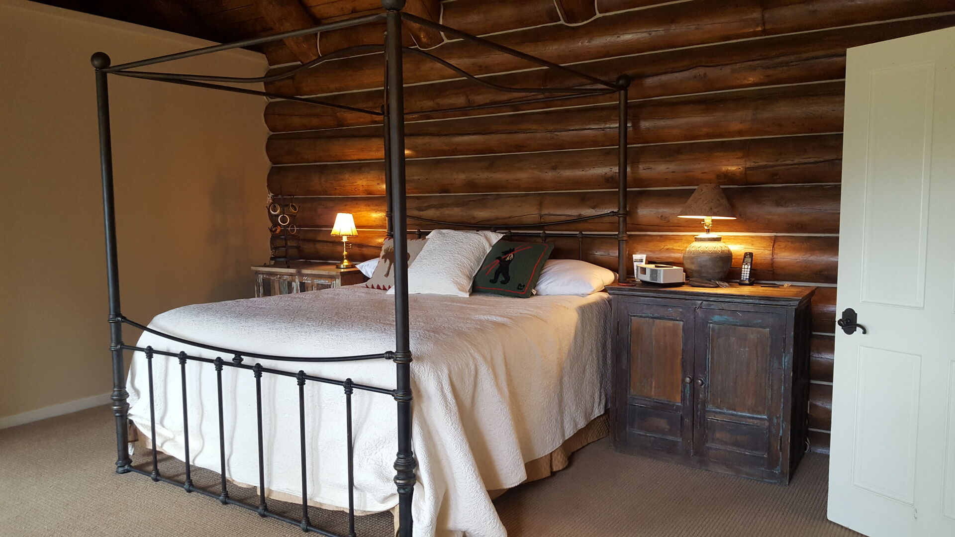 Bedroom with Log Cabin Wall at Ski Ranches Cabin