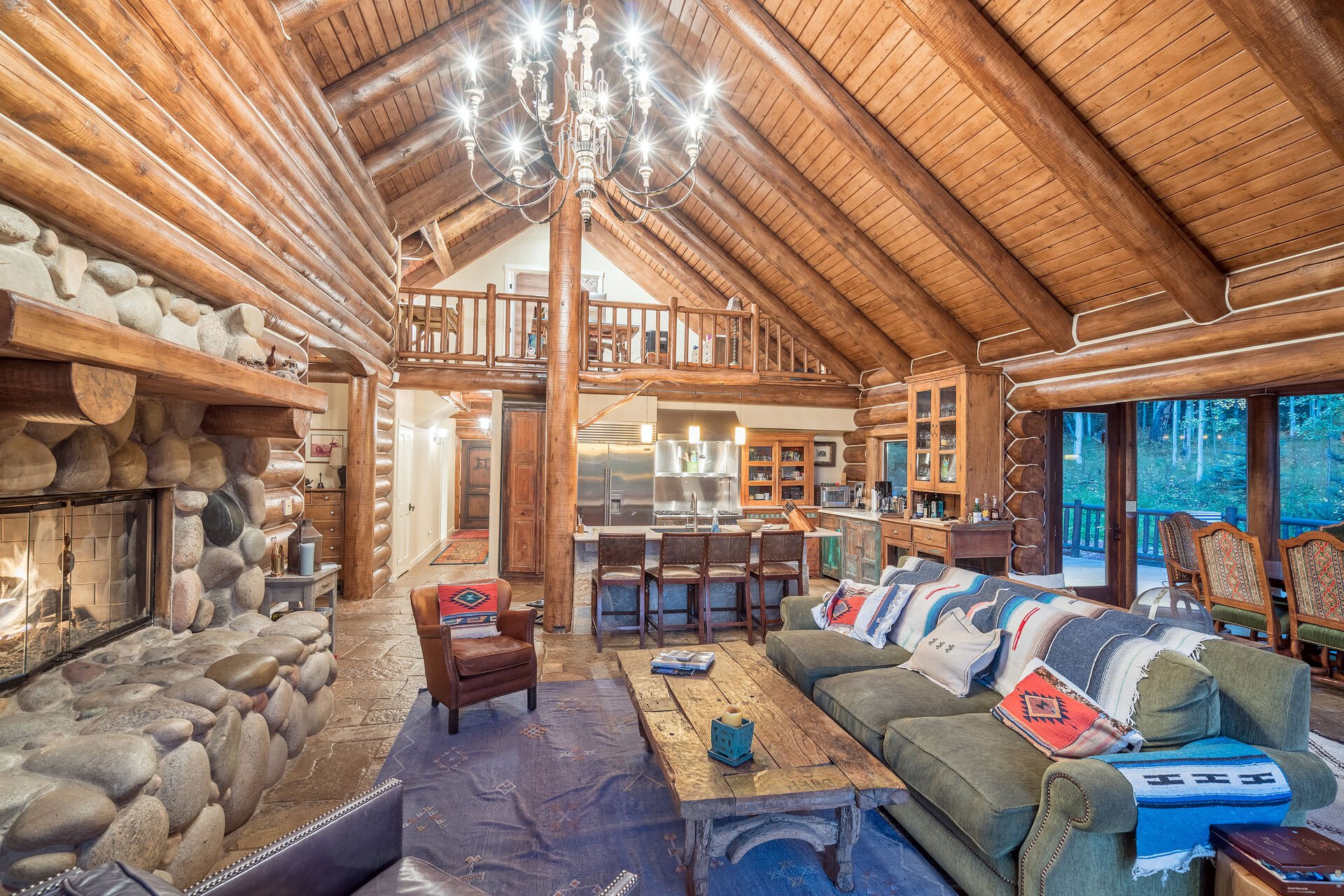 Living Area with Lofted Ceilings and Fire Pit at Ski Ranches Cabin