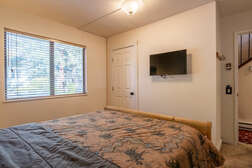 Guest Bedroom #2 on first level; Queen Bed/Flat Screen TV/Full En-suite Bathroom