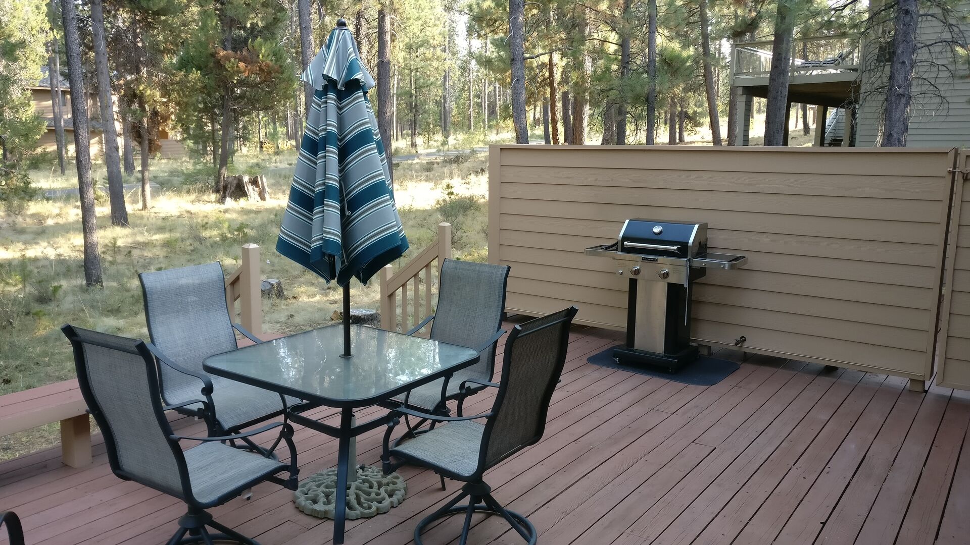 Deck with comfortable patio furniture and propane BBQ
