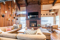 Living Room, sectional, 60 inch flat screen smart tv and wood burning fireplace