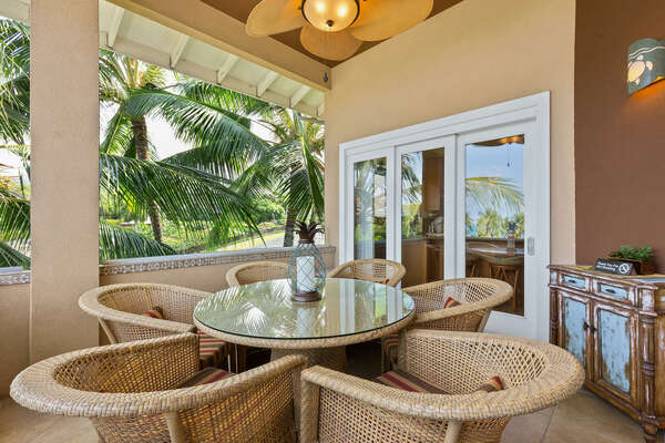 Angled photo of the lanai with table and chairs.