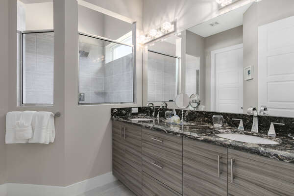 The ensuite bathroom has his and hers vanity and large walk-in shower