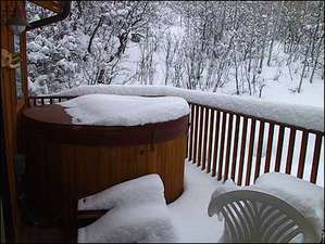Outdoor hot tub on private deck