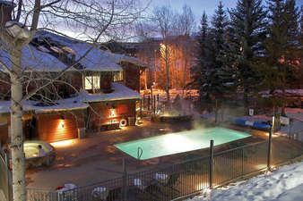 Pool and Hot Tub area in winter - no snow on the heated pool deck