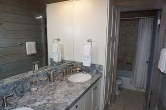 Newly remodeled bathroom shared by second and third bedroom