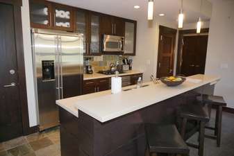 Fully Equipped Kitchen with bar seating for 3
