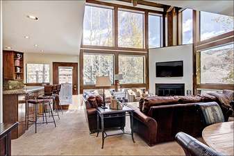 Stunning Living Room has Vaulted Ceilings and Large Picture Windows