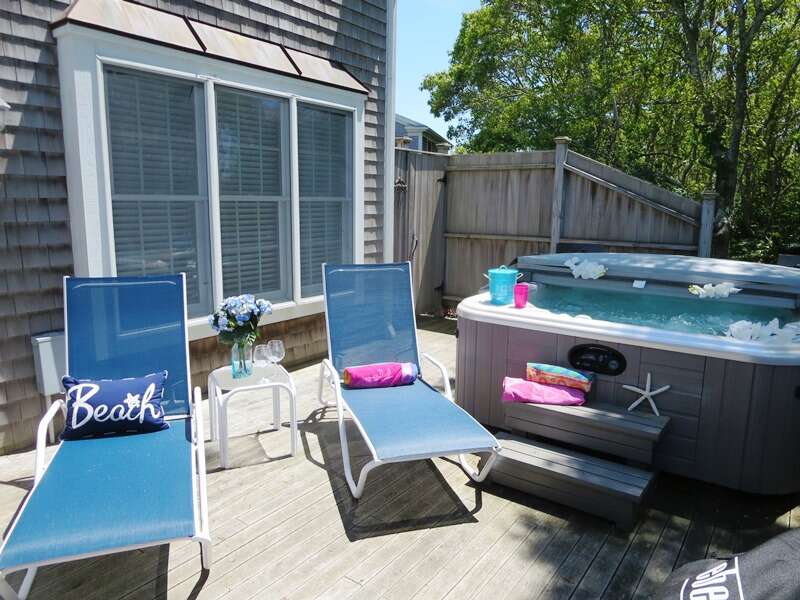 Enclosed outdoor shower, lounge chairs, outdoor dining, gas grill, and a hot tub! - 24 Sea Mist Lane Chatham Cape Cod New England Vacation Rentals