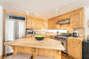 Open kitchen with modern stainless steel appliances.  $ burner gas stove , great island or enjoying coffee and breakfast.