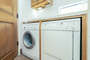 The washer and dryer are located on the third level in the Primary ensuite bathroom.