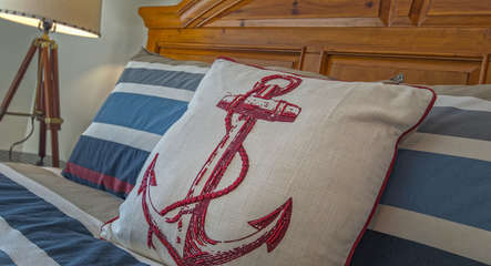 White Pillow with Red Anchor