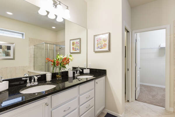 En suite master bathroom with walk-in shower and separate bathtub