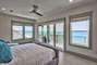 A sliding glass door to the balcony in the bedroom of this rental.