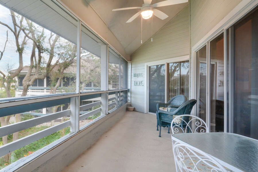 Lovely screened in back porch pf this vacation rental in New Smyrna Beach FL.