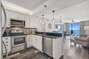 Fully Equipped Kitchen Features Stainless Steel Appliance, Custom Cabinets and Granite Counter Tops and a View