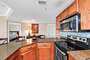 Fully Equipped Kitchen with Stainless Appliances and granite counter tops have extra seating at the Breakfast Bar