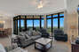Spacious Living and Dining Areas with floor to ceiling windows reveal a fantastic view of paradise