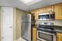 Full Size Kitchen with Stainless Steel Appliances and Breakfast Bar